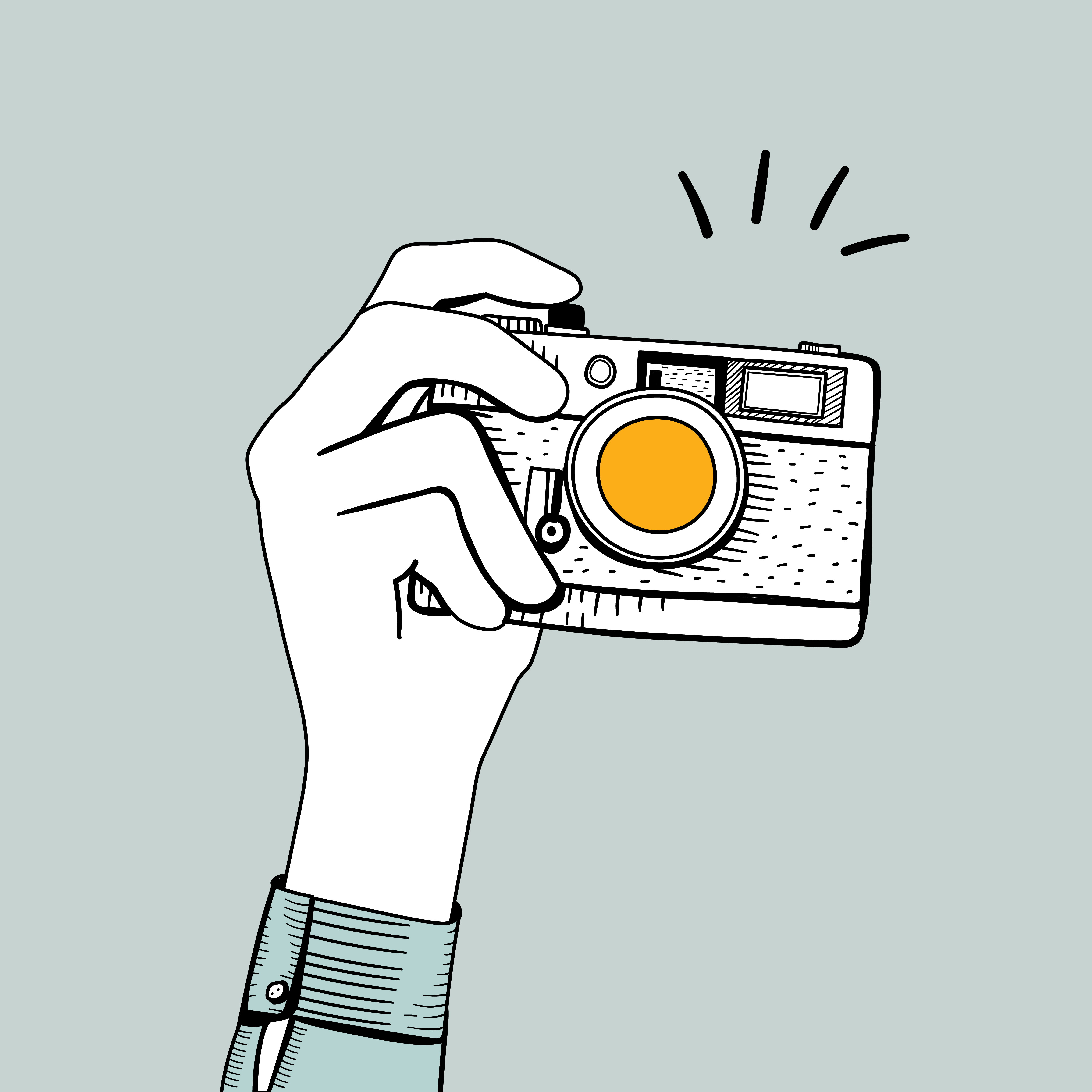 Imagen ilustrativa. Mano sosteniendo cámara fotográfica
