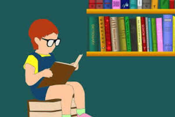 Niño leyendo un libro.