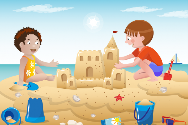 Niños en la playa construyendo un castillo de arena. Imagen libre de derechos de autor. 