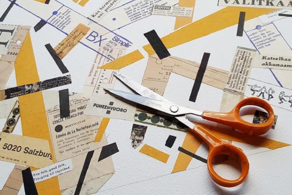 Recortes de papeles y una tijera de uso escolar