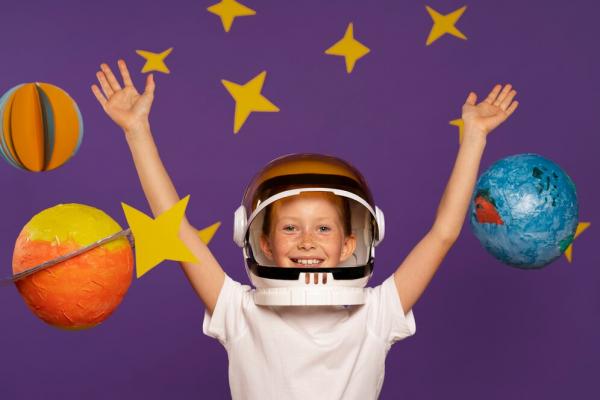 niño astronauta en el espacio